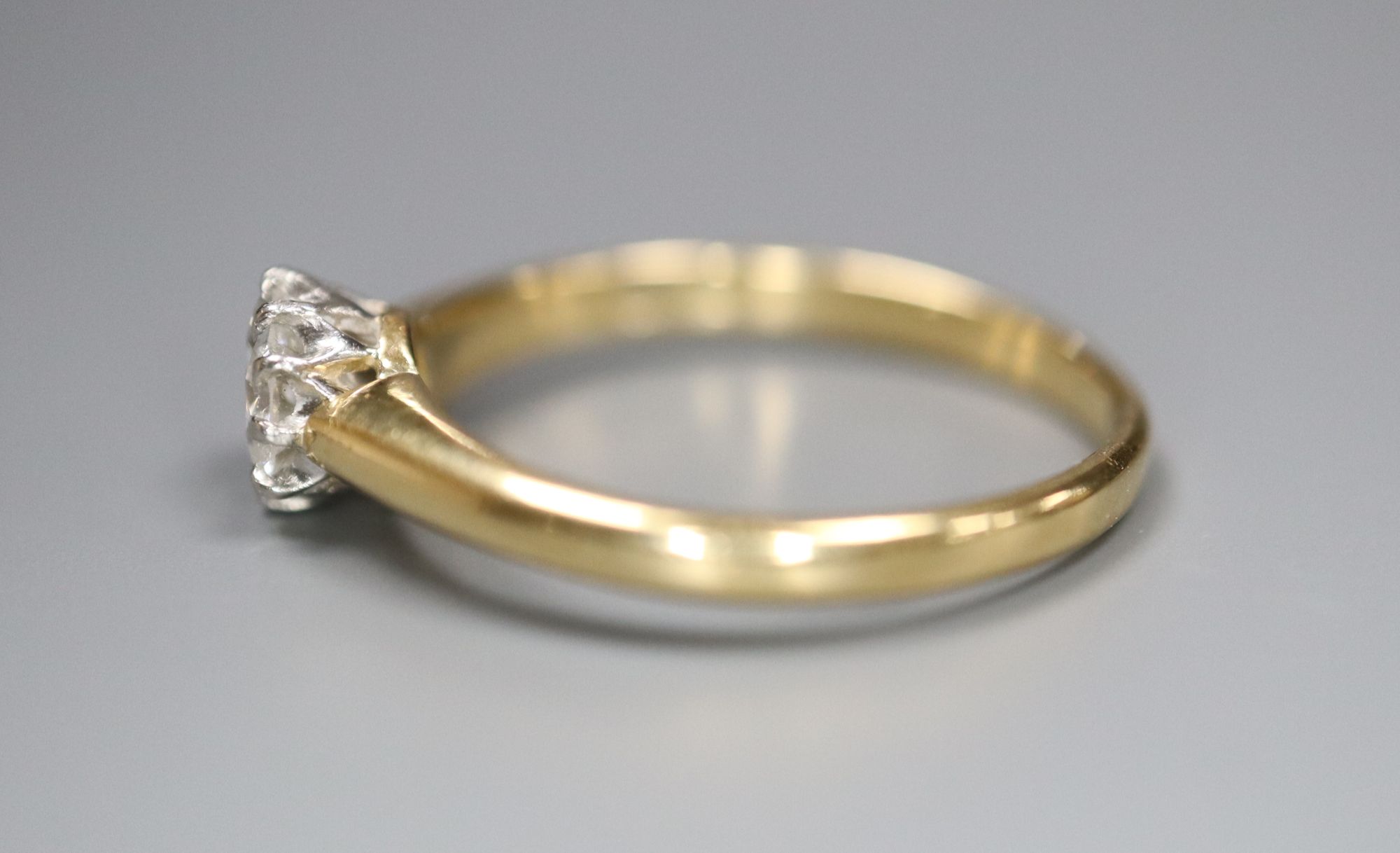 An 18ct and solitaire diamond ring, size G, gross 1.7 grams.